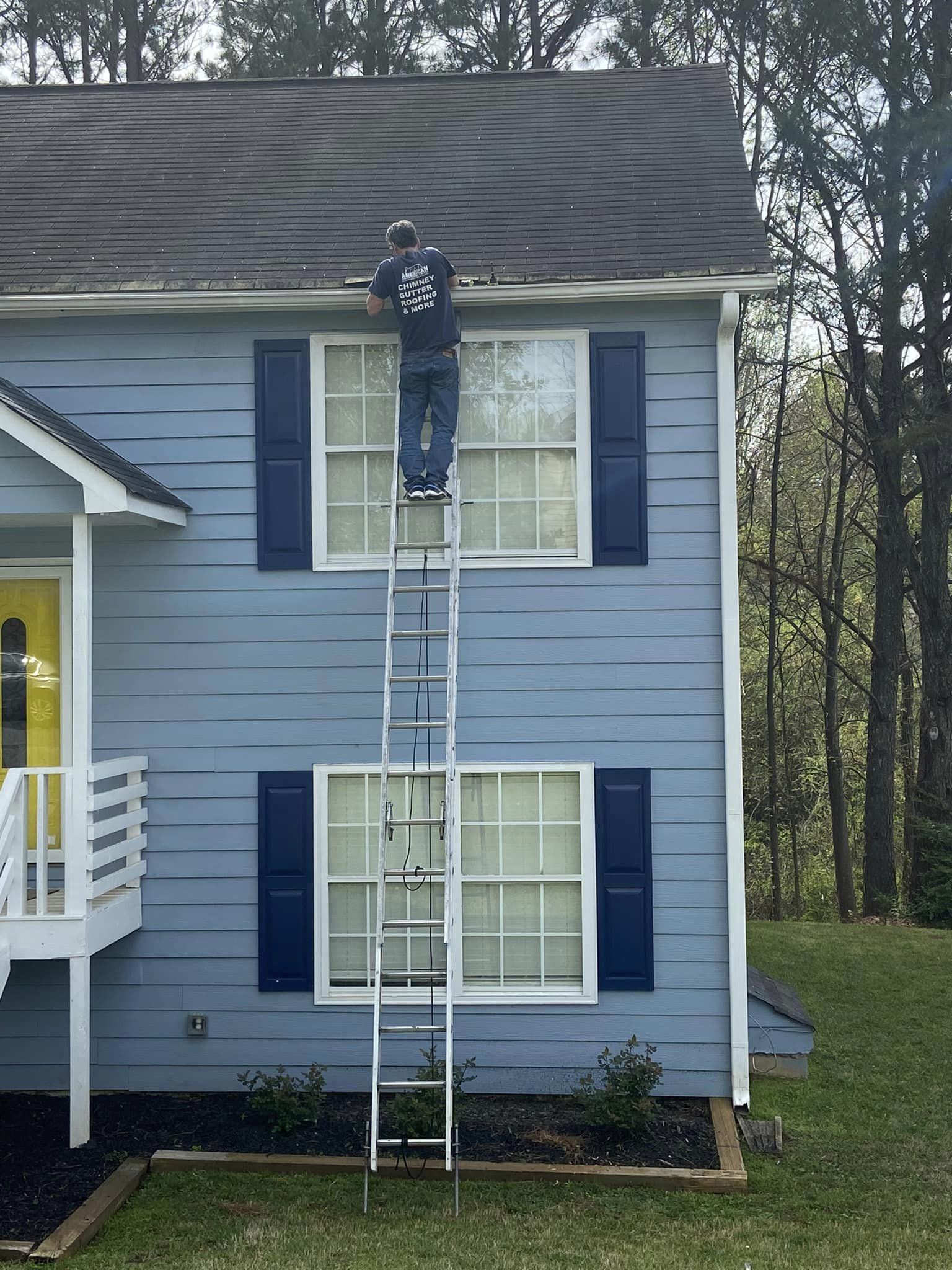 Cleaning gutters on a two story house